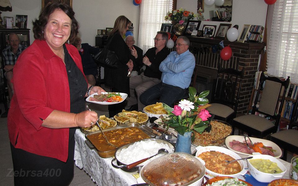 06-Joan samples some of Laurie's food.JPG